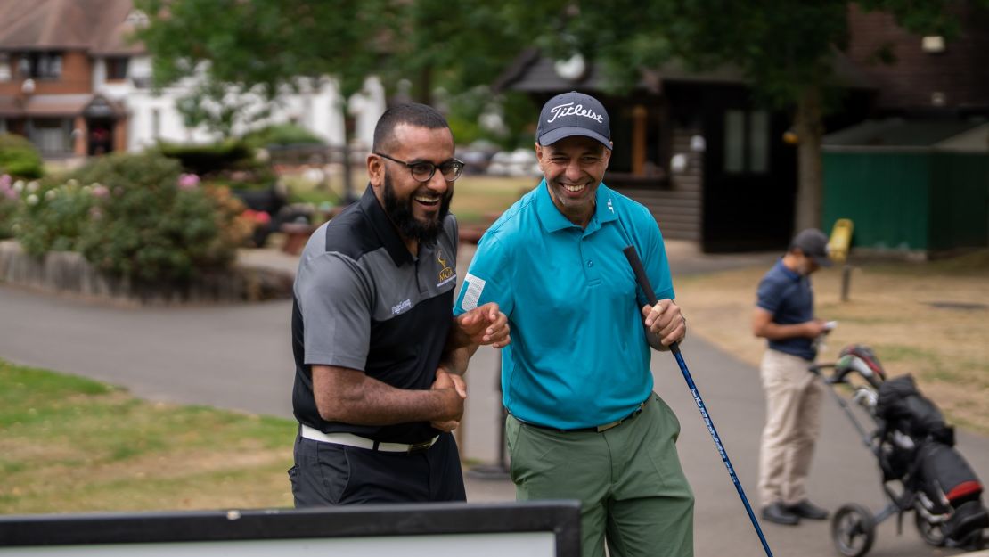 Amir Malik (L) is passionate about golf.