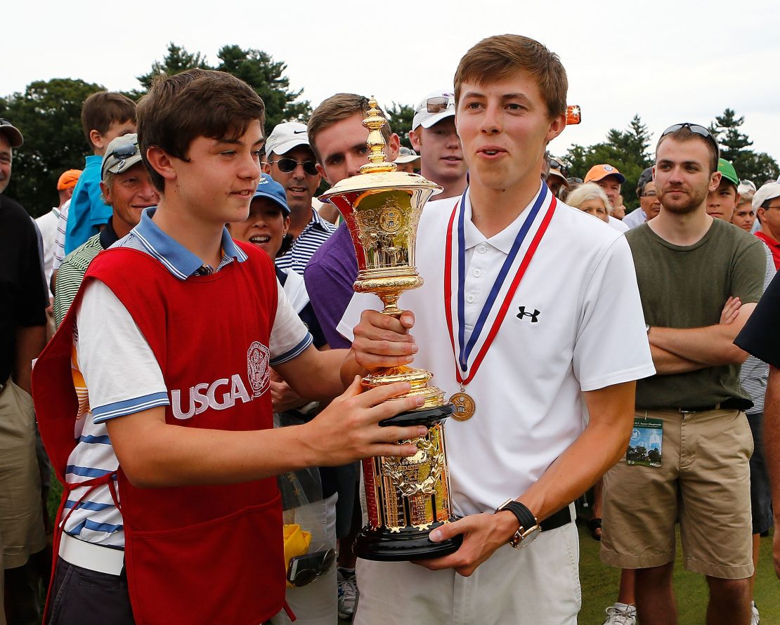 Matt Fitzpatrick holds the Havemeyer trophy with his caddie and brother Alex after winning the 2013 US Amateur Championship.