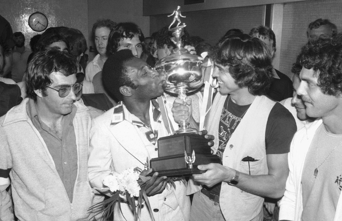 Pelé lifts the NACL trophy after winning the title in his last season in the US. 