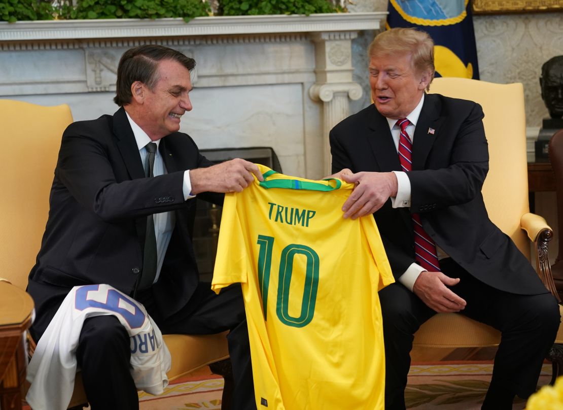 Brazilian President Jair Bolsonaro presents US President Donald Trump with a Brazil national team jersey at the White House March 19, 2019 in Washington, DC.