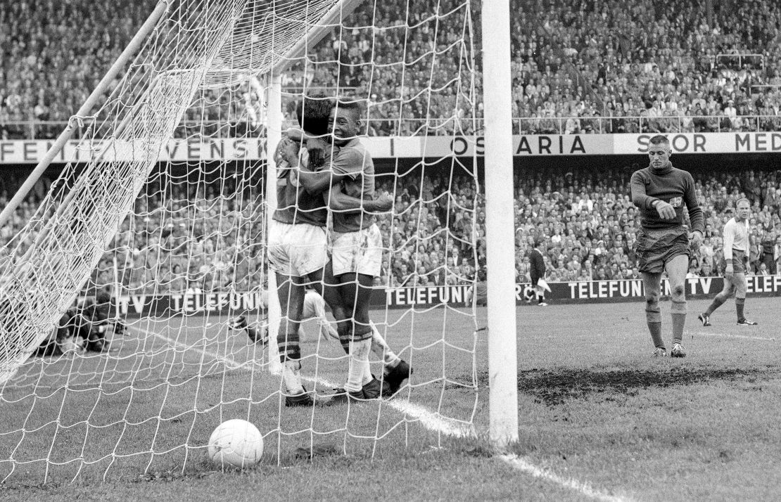 Pelé hugs his teammate Vava after scoring the goal to take the score to 2-1 in the 1958 World Cup final. 