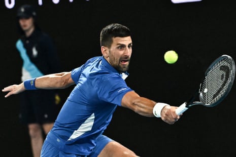 Novak Djokovic reaches out for a backhand.