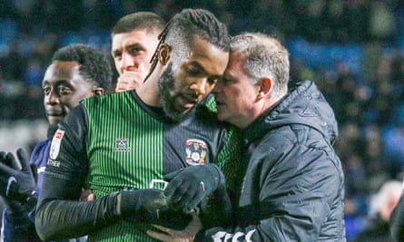 Kasey Palmer is consoled by the Coventry manager, Mark Robins, after the game at Sheffield Wednesday.