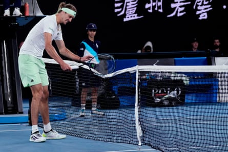 Alexander Zverev bangs the net with his racket in frustration during the final set