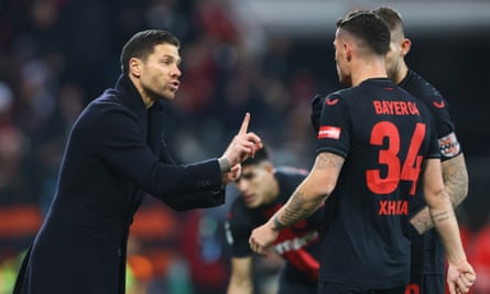 Xabi Alonso gives instructions to Granit Xhaka during the DFB Cup last 16 match between Bayer Leverkusen and SC Paderborn