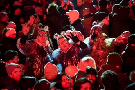 People celebrate at the Brandenburg Gate party in Berlin.