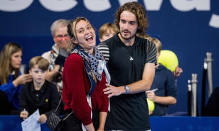 Stefanos Tsitsipas and the Spanish tennis player Paula Badosa share a joke on court. 