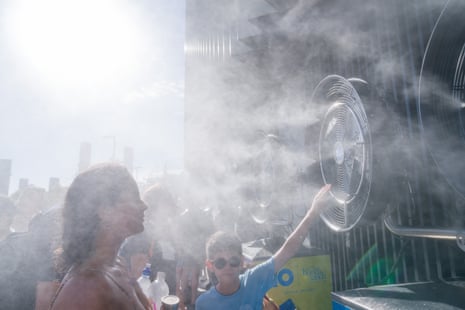 Melbourne visitors cool off next to fans during day two.