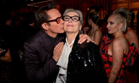 Robert Downey Jr, Meryl Streep and an onlooker at the Globes.