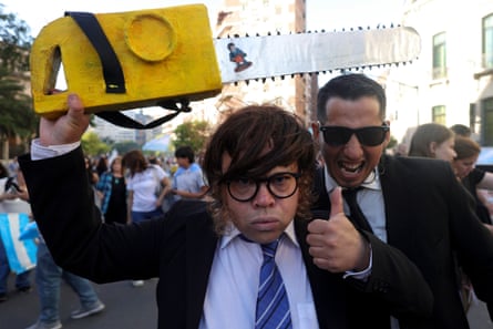 A supporter of Javier Milei with a fake chainsaw during a campaign rally in Córdoba, Argentina, November 2023.