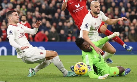 Sofyan Amrabat and the goalkeeper André Onana collide during Manchester United’s draw at Anfield.