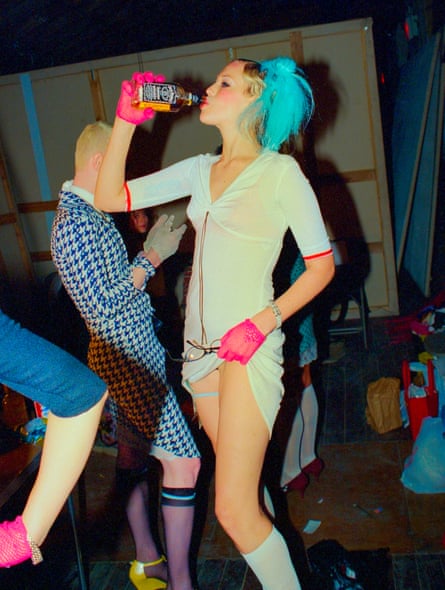 Amanda gets ready to walk in a show for designer Judi Rosen in the mid-90s, swigging from a whiskey bottle.