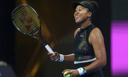 Naomi Osaka smiles after beating Caroline Garcia in their first-round match of the Qatar Open