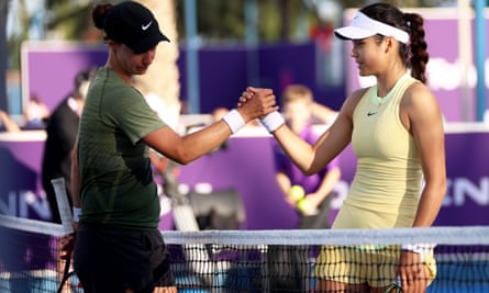 Emma Raducanu shakes hands with Anhelina Kalinina over the the net in Doha