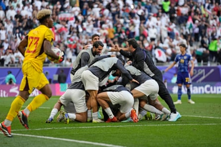 Iran’s players celebrate the penalty by Alireza Jahanbakhsh that took them past Japan in the Asian Cup quarter-finals.