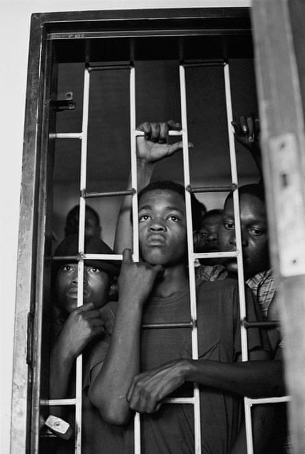 Black boys in 1960s South Africa in jail for trespassing in a white area