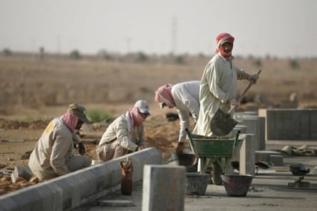 Asian labourers work on a project just outside the capital Riyadh.