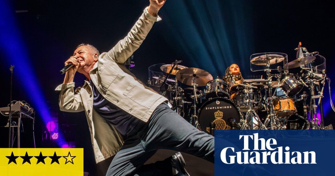 “Review of Simple Minds’ stadium tour showcases their 80s hits success.”