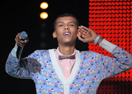 Stromae performing on stage in Paris in 2010.