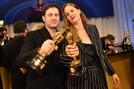 Delight … Justine Triet, right, and Arthur Harari, winners of the best original screenplay Oscar for Anatomy of a Fall.