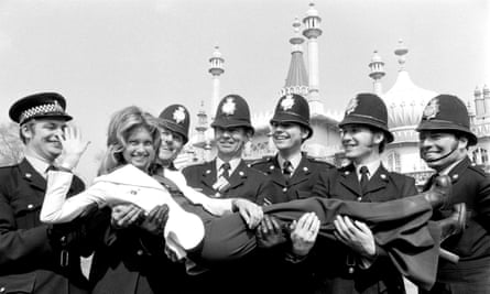 Olivia Newton-John poses with policemen in Brighton prior to the 1974 Eurovision song contest.