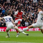 Arsenal survive late Spurs fightback to boost title charge with derby victory