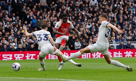 Arsenal survive late Spurs fightback to boost title charge with derby victory
