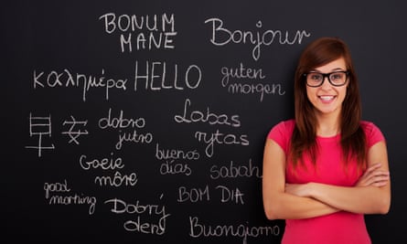 Woman in front of a blackboard with foreign languages