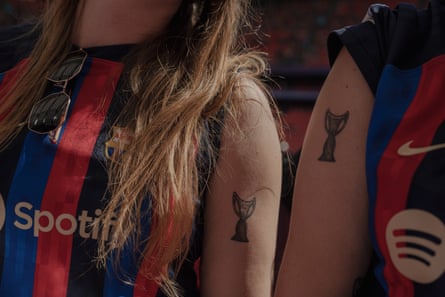 Barcelona fans Ina and Maria display their matching tattoos at the fan zone in Bilbao ahead of the 2024 Women’s Champions League final between Barcelona and Lyon.