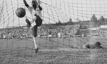 Pelé adds another goal to his tally while playing for Santos.