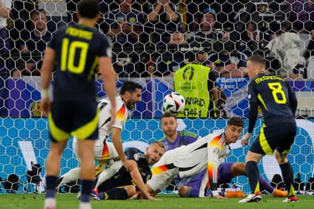 Ryan Porteous fouls Germany’s Ilkay Gündogan in the penalty area.