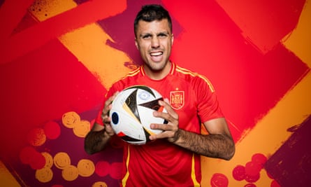 Spain’s Rodri holds a ball at a photoshoot
