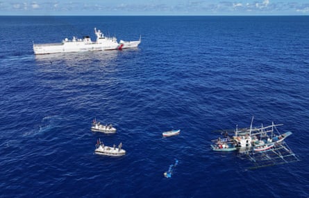 n aerial drone photo taken on June 29, 2024 shows the China Coast Guard assisting injured Filipino fishermen in waters adjacent to China’s Huangyan Dao, known as Scarborough Shoal.