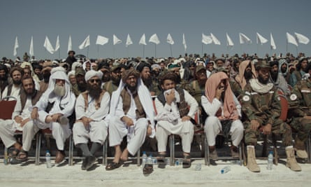 Dozens of Taliban form a seated, open-air audience in a scene from Hollywoodgate.