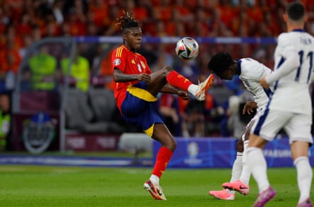 Spain’s Nico Williams reaches for the ball in front of England’s Kobbie Mainoo during the Euro 2024 final.