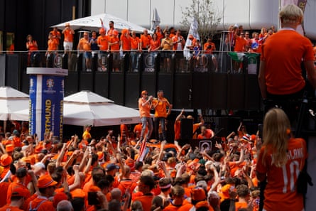 Dutch fans enjoy the atmosphere on the streets of Dortmund before the Euro 2024 semi-final between the Netherlands and England