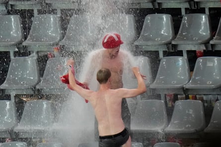 Danish fans get a tad damp.