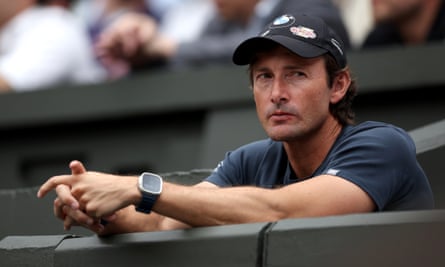 Juan Carlos Ferrero wears a baseball cap.