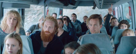 Fanni Metelius, Kristofer Hivju and Johannes Kuhnke among other tourists and their children on a bus in snowy country