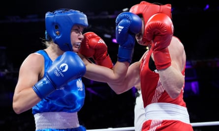 Poland’s Aneta Rygielska, left, puches, Britain’s Rosie Eccles