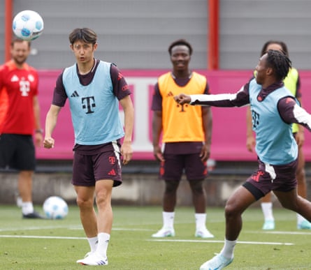 Bayern Munich’s Hiroki Ito (left) eyes the ball during a training session on 17 July 2024.