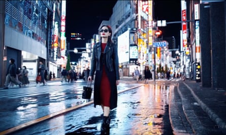 film still of a woman on a city street at night