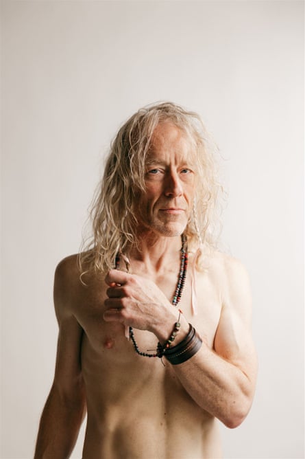 Portrait of Alan Sparhawk, standing, topless.