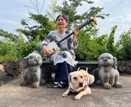 Rieko Hirosawa, with her guide dog Sophia, performs the music of the goze – itinerant blind and visually impaired women who earned a living playing the shamisen