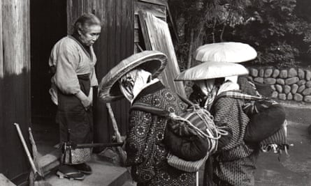 Goze musicians perform outside a farmhouse in this undated photo