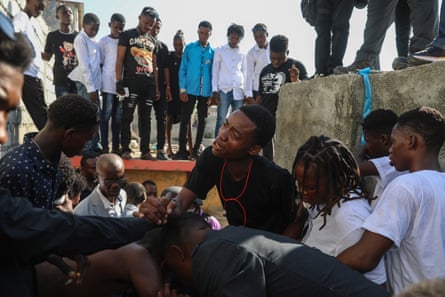 Mourners at a burial service