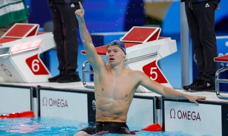 Leon Marchand celebrates gold in the Olympics men’s 400m medley