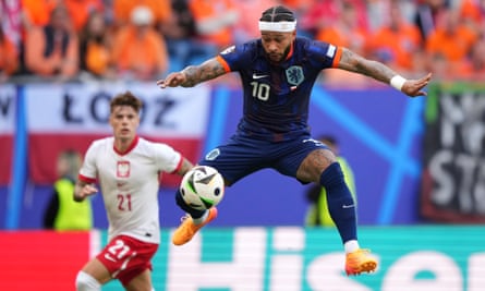 Memphis Depay of the Netherlands controls the ball in the air ahead of Poland’s Nicola Zalewski during their Euro 2024 match