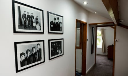 Framed photos of the Beatles on walls in the building