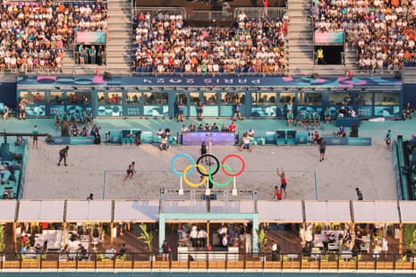 Christian Sandlie Sorum and Anders Berntsen Mol of Norway play against Steven Van de Velde and Matthew Immers of the Netherlands in the preliminary phase of the men’s beach volleyball at the Champ de Mars Arena, photographed from the Eiffel Tower